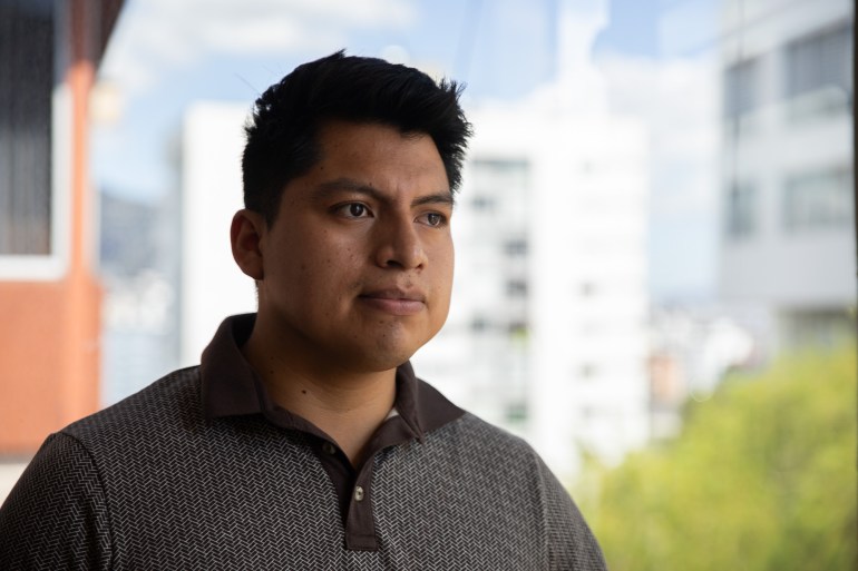 Brandon Samueza poses for a photo outside in Quito